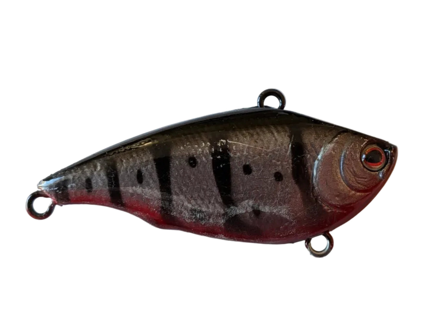 Fishing lure with a striped pattern on a white background