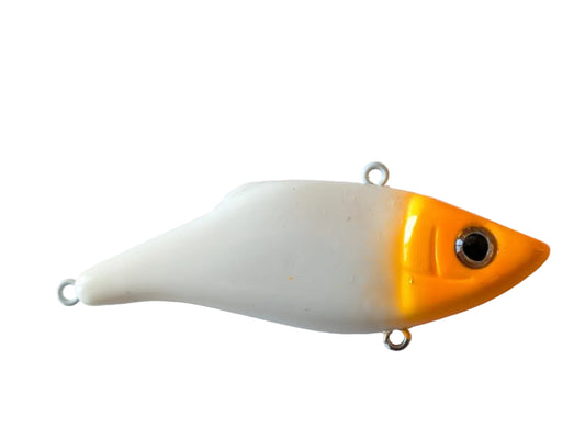 Fishing lure with orange top and white bottom on a light gray background
